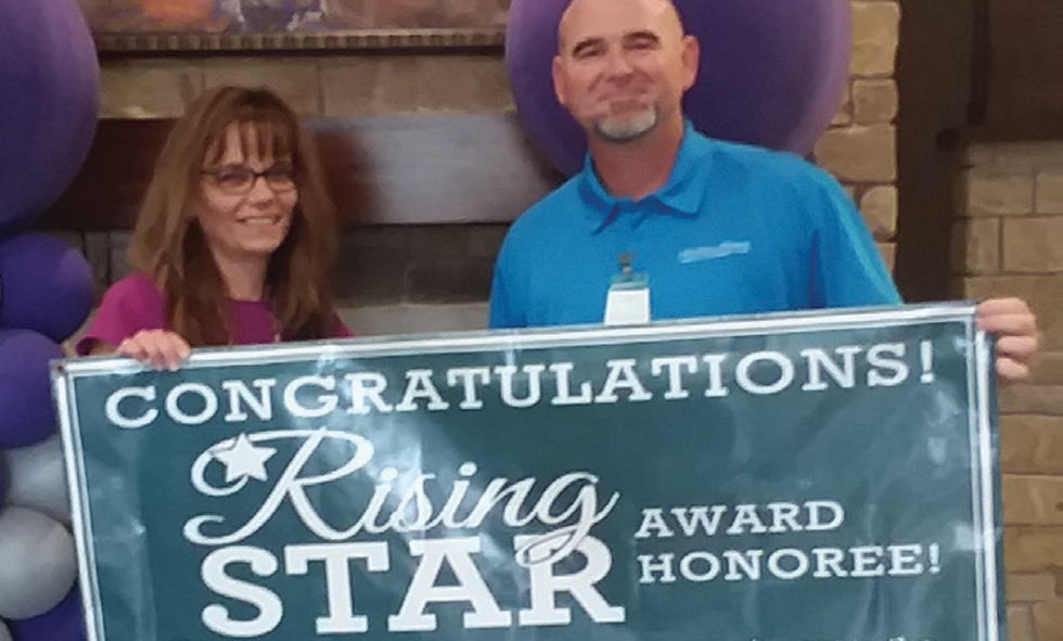 Elvira Webber with Rising Star Award Banner