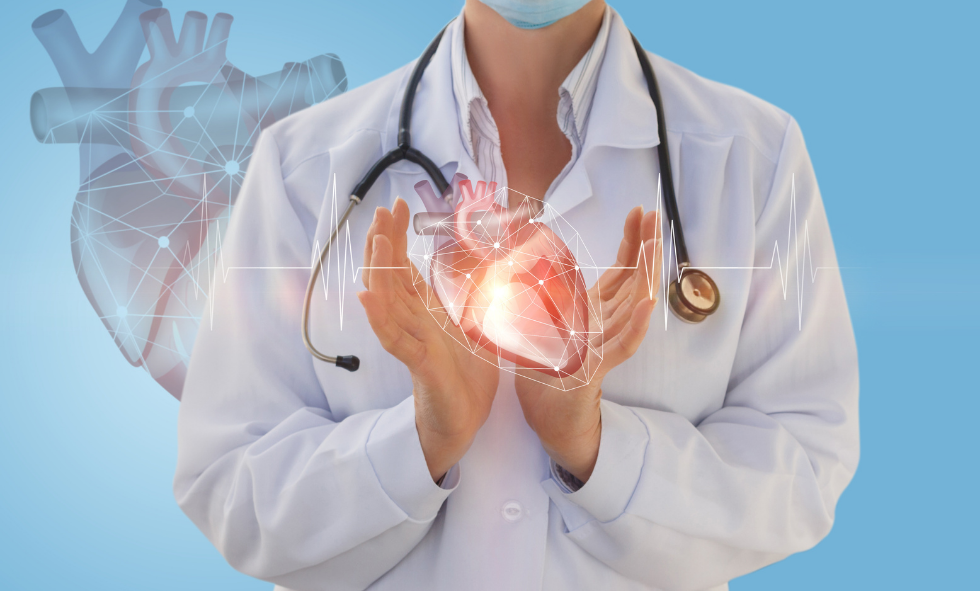 Cardiovascular doctor holding a glowing heart with a stethoscope around