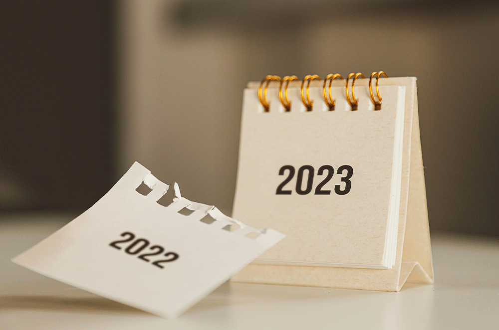 Small standing calendar with 2022 page torn off, showing 2023