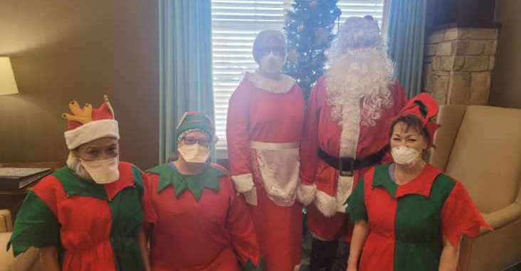 MTNRC employees dressed up as Santa, Mrs. Claus, and Christmas elves