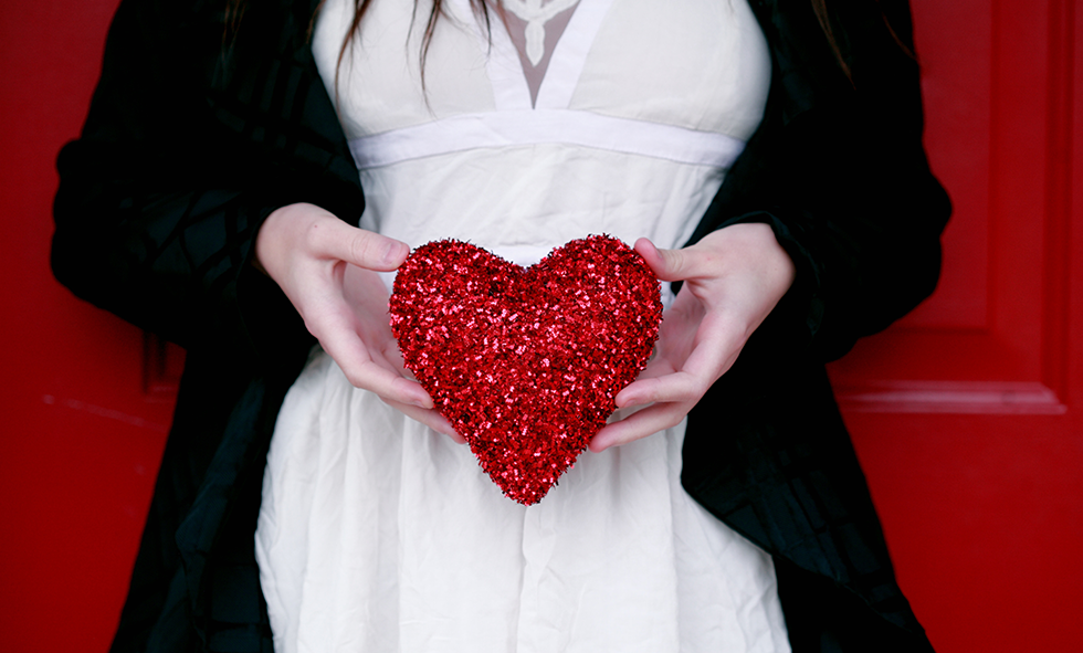 woman holding decorative heart