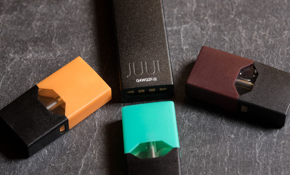 4 juul devices on table