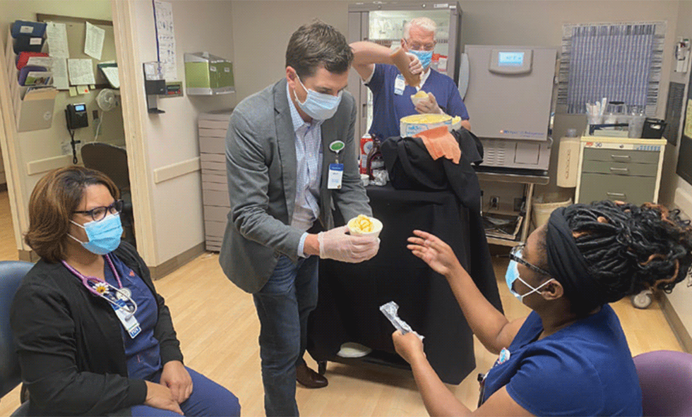Handing out snacks to nurses and hospital staff