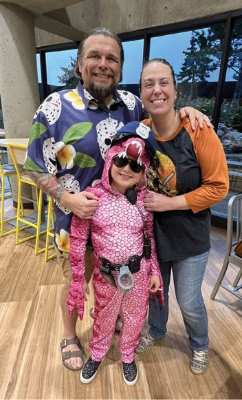 Mother and father with daughter at CCMH 2025 NICU reunion
