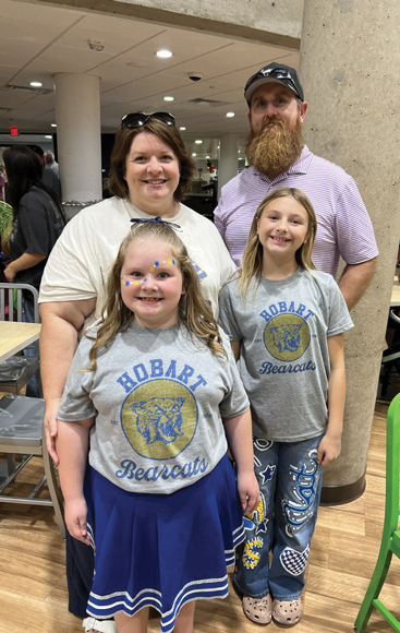 Mother and father with two daughters at CCMH 2025 NICU reunion