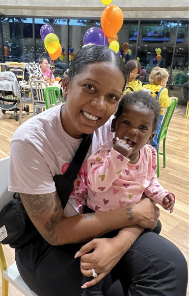 Mother with daughter at CCMH 2025 NICU reunion